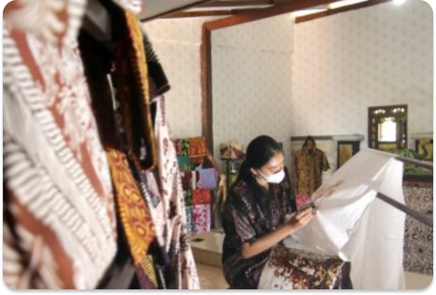 A person working on batik craft